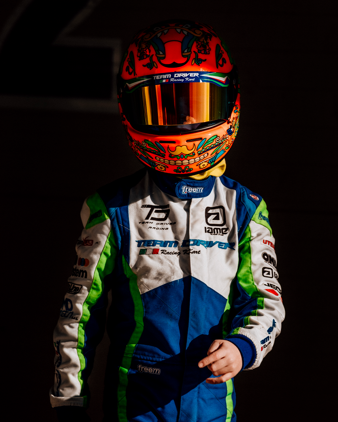 Studio-style portrait of Guido in racing gear